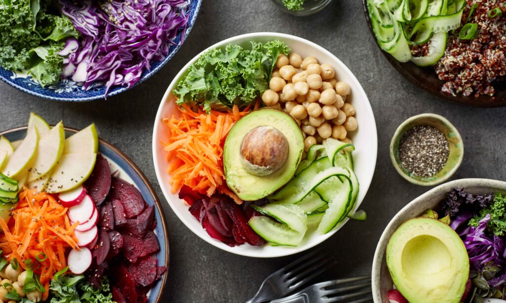 Breakfast vegan bowls for healthy eating on gray table, top view