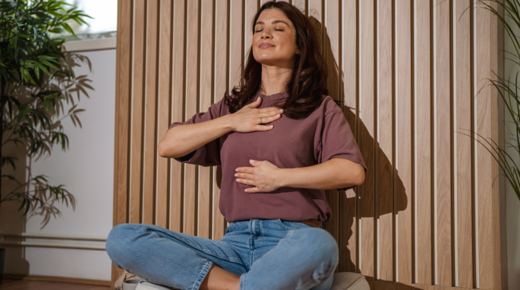 woman exercising breathing and learning how to meditate